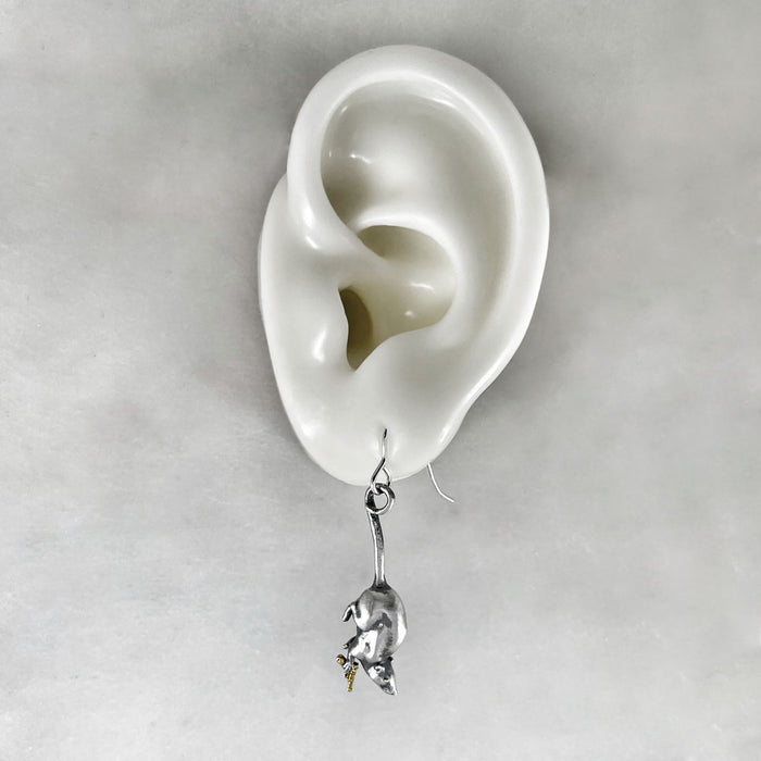 rat earrings on ear