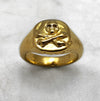gold skull and crossbones ring detail view